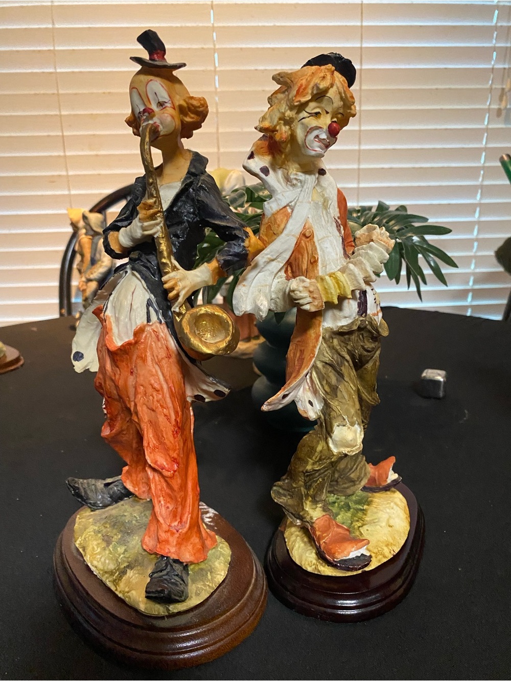 Source Unknown Orange & Multicolor Clown Musician Sculpture Pair